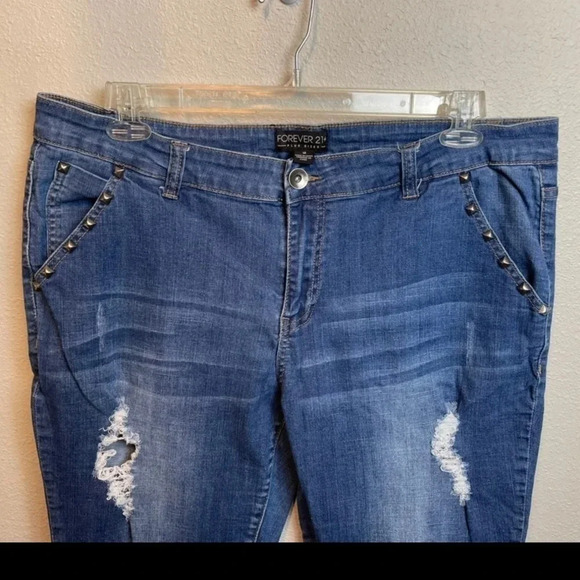 FOREVER21+ distressed jeans with studded detail. Cotton/spandex blend.
Size: 18 - Picture 5 of 12